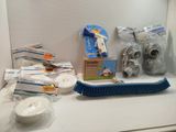 a lot of cleaning supplies on the counter top