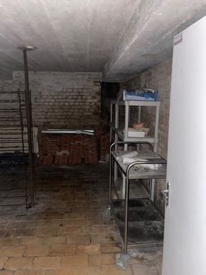 an image of a room with a brick wall and a ladder