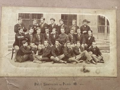 an old photo of a group of men posing for a picture