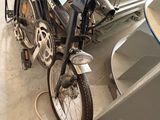 a motorcycle that is parked next to a boat