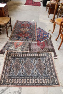 several rugs are laid out on the floor in a room