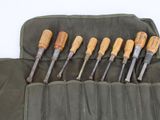 a roll up tool bag with six different woodworking tools in it