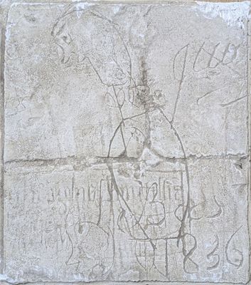 a stone block with a drawing of a man on it