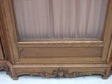 a wooden cabinet with a mirror on top of it