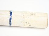 a roll of paper with writing on it sitting on a table
