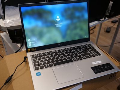 a laptop computer sitting on top of a box on a table