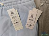 two tags on the back of a pair of pants