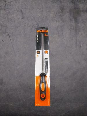 a pair of scissors sitting on a black surface