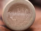 a close up of a bottle with writing on it