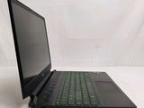 the back of a laptop with a green keyboard on a white surface