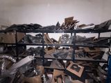 a large pile of cardboard and cardboard boxes in a room