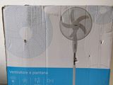 a box with a fan inside of it on a table