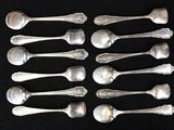 a lot of spoons and spoon spoons on a black surface