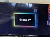 a flat screen tv sitting on top of a desk