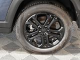 a close up view of a tire on a vehicle