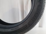 a close up of a tire on a white surface