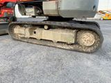 an image of a tractor and a bulldozer in a parking lot