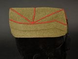 a hat with a red line on it on a mannequin head