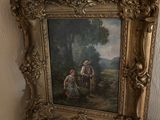 une photo d'un tableau posé sur une table, à côté d'un napperon