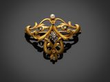 une broche en or et diamants