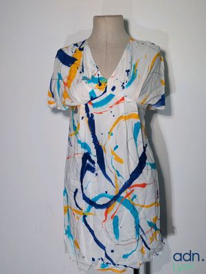 an image of a dress on a mannequin with paint splatters all over it