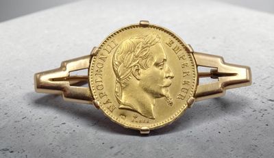l'image d'un anneau d'or surmonté d'une pièce de monnaie