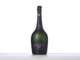 the bottle of champagne is sitting on the table