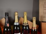 several bottles of wine are lined up on a table