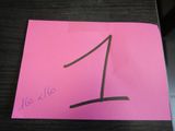 a pink post it note with the number one on it