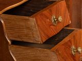 a wooden desk with two drawers on top of it