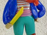a figurine of a pirate with a hat and a sword