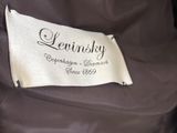 a close up of the label on a brown jacket