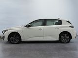 the white car is parked on the concrete floor in the room
