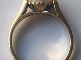 an image of a ring with a pearl on top of a white surface