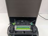 an image of a robotic vacuum cleaner sitting on top of a table