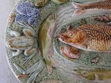 a plate with a fish and other fish on it
