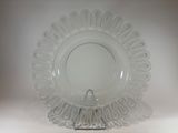 a clear glass plate with a decorative design on it