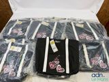 a lot of bags that are sitting on a bed