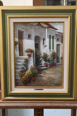 an oil painting of a house with potted plants on a easel