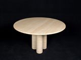 a round wooden table on a black background