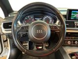 the interior of a car with a steering wheel and dashboard controls