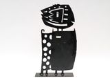 black and white metal sculpture of a man with a fish on his head