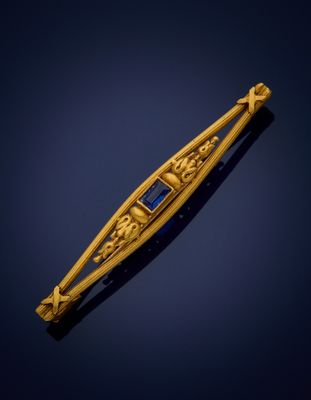 an image of a gold and blue stone broochle