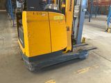 a forklift that is parked in a warehouse