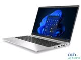 an open laptop computer sitting on top of a white surface