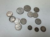 some coins are sitting on a table with a white background
