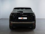 a picture of a black suv parked in a room