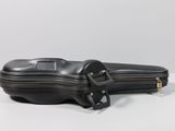 a black violin case sitting on a white table