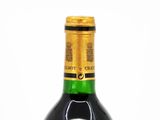 a bottle of wine that is sitting on a table
