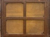 an old wooden window with a wooden frame on top of it